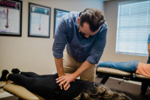 Chiropractor giving service